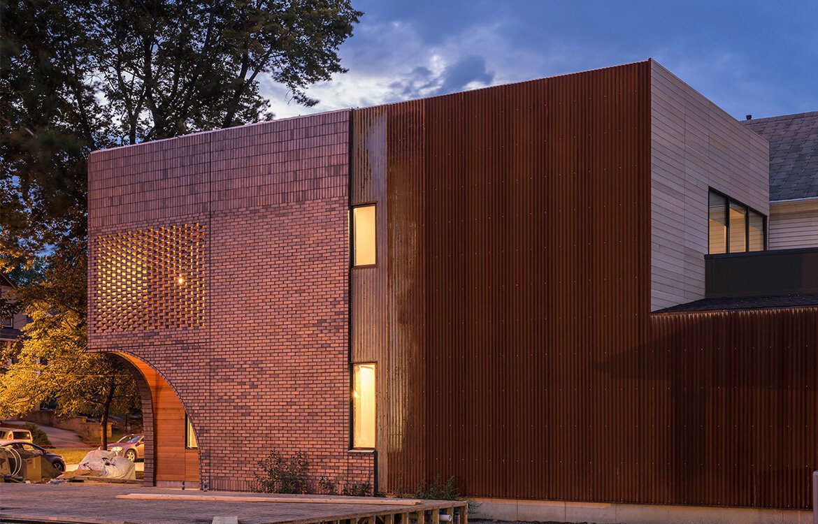 A building with a brick facade and a large window.